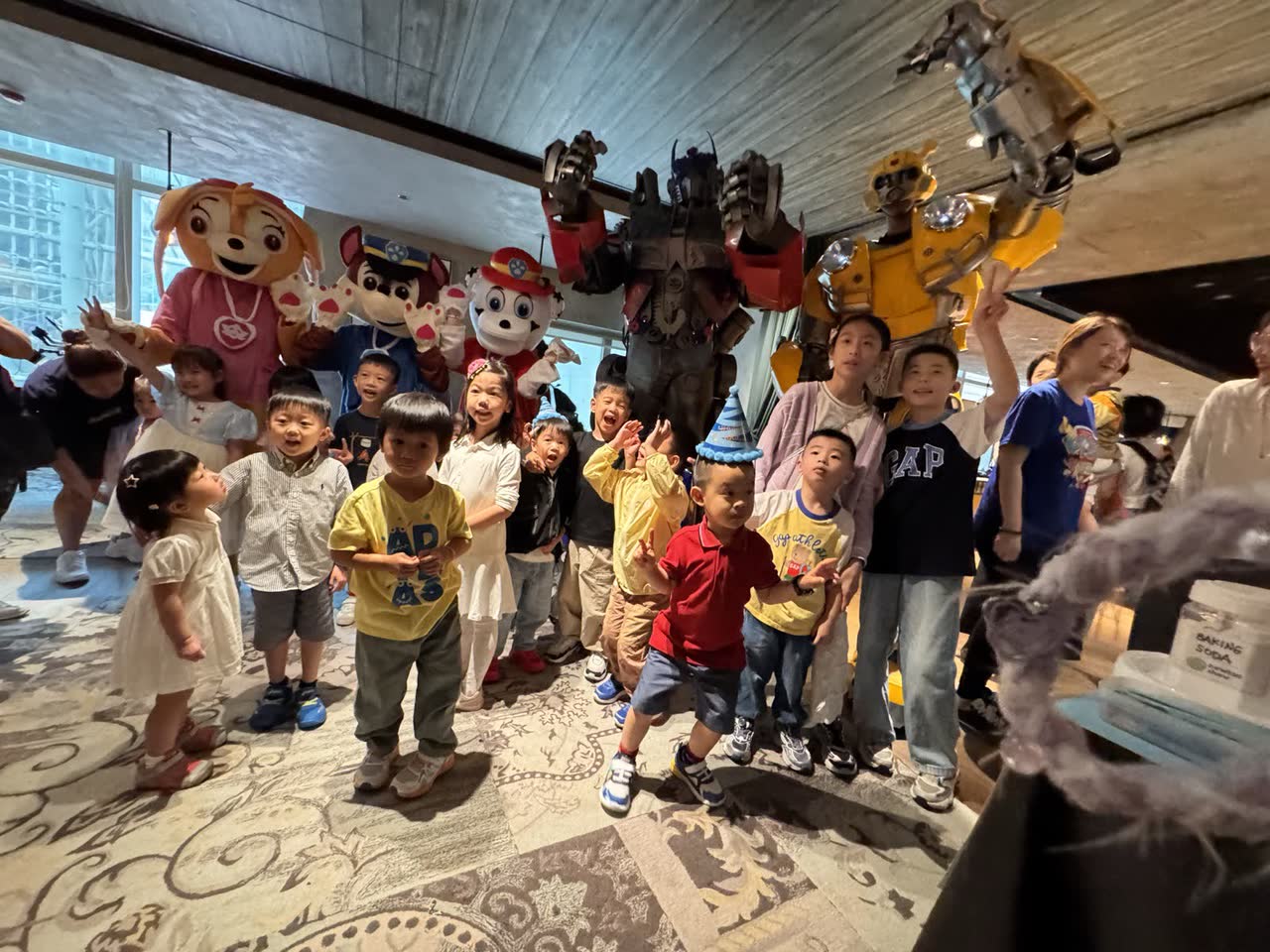 Costumed characters greeting children at a Newtonshow birthday party in Hong Kong