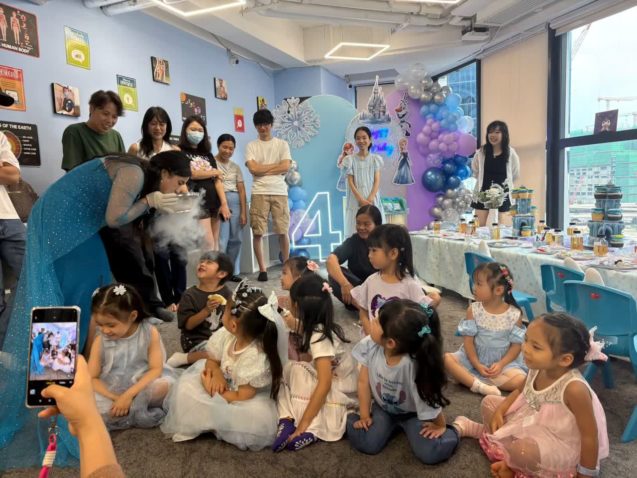 Children celebrating together in a fully decorated Newtonshow party room