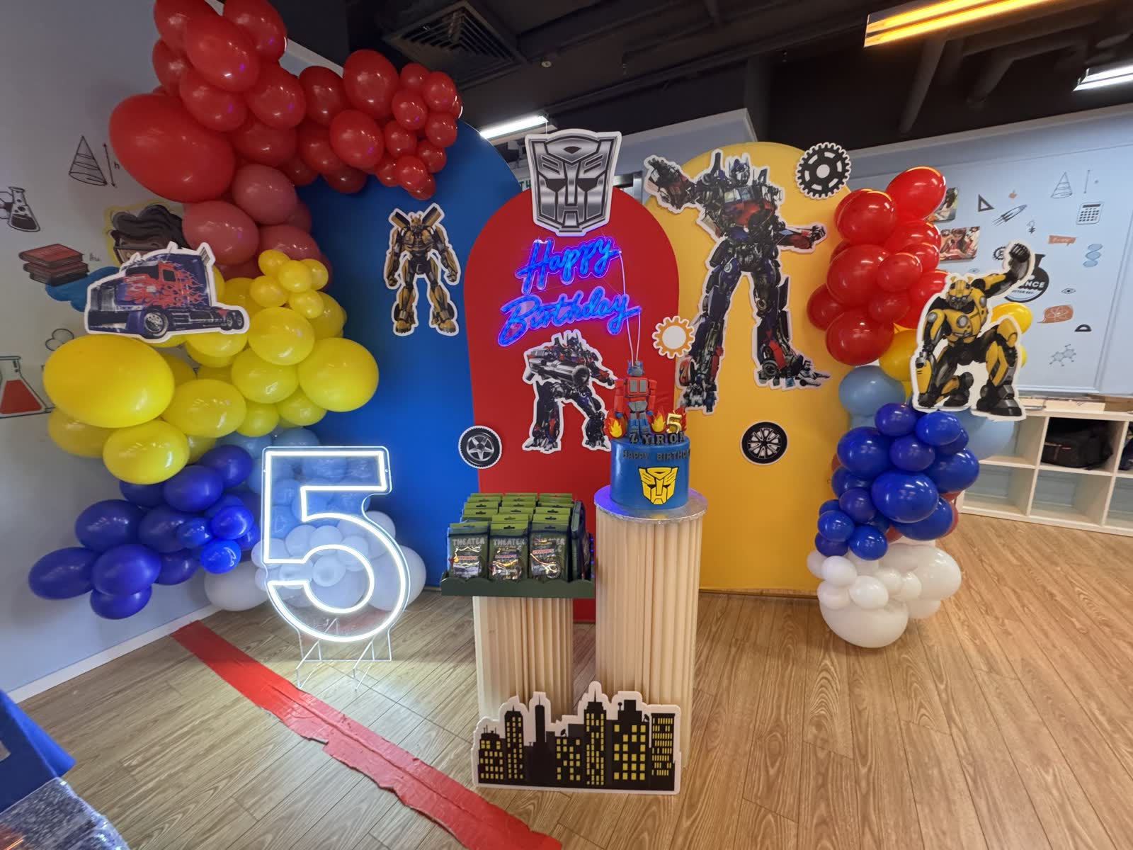 Transformers-themed birthday party set-up with balloon arch and dessert stand at Newtonshow Hong Kong