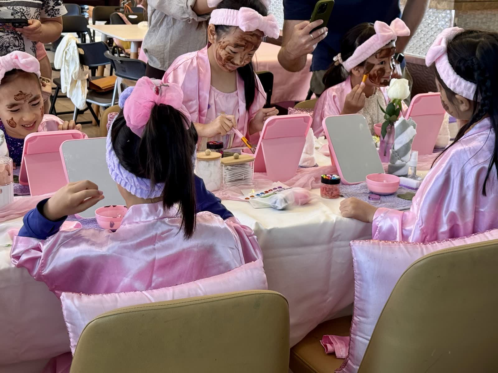 Child making her own beauty products at a spa station during a Newtonshow spa party