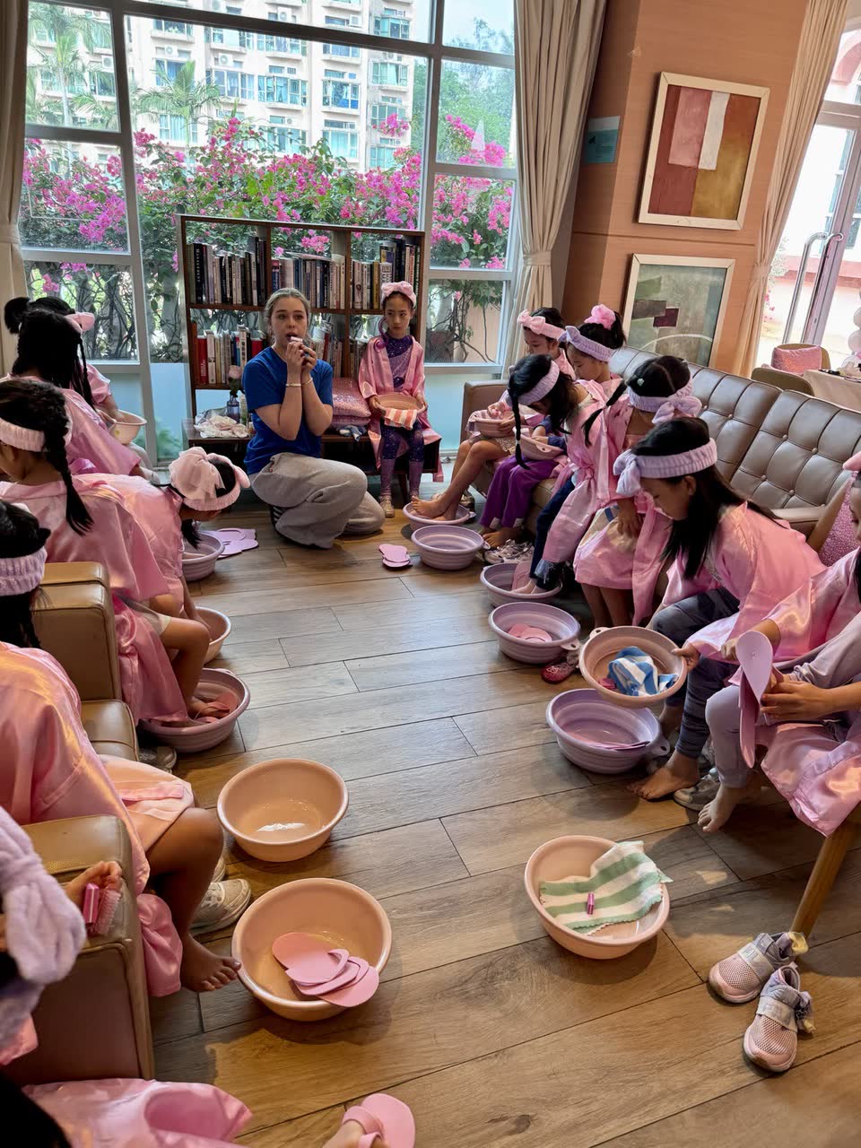 Group of children enjoying a pedicure circle at a Newtonshow kids spa party in Hong Kong