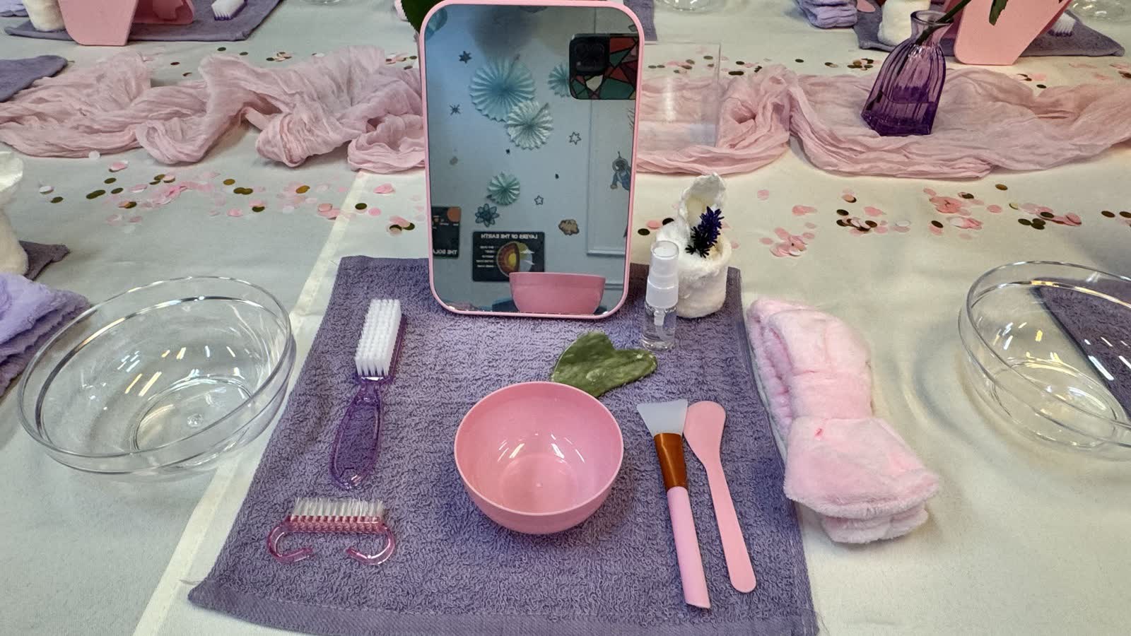 Spa station laid out with a bowl, brushes and towel at a Newtonshow kids spa party