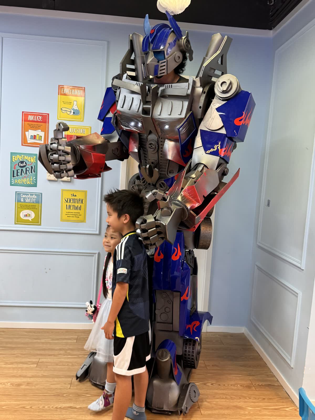 Child meeting a life-size Transformers character at a Newtonshow birthday party