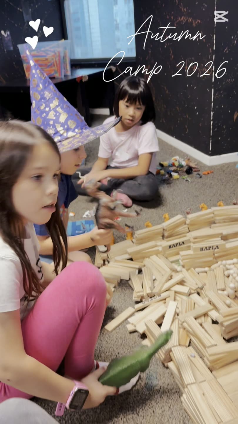Children building a giant wooden-block structure at a Newtonshow Hong Kong camp